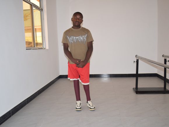 HE ONCE CRAWLED. TODAY, HE WALKS TOWARD HIS DREAMS.